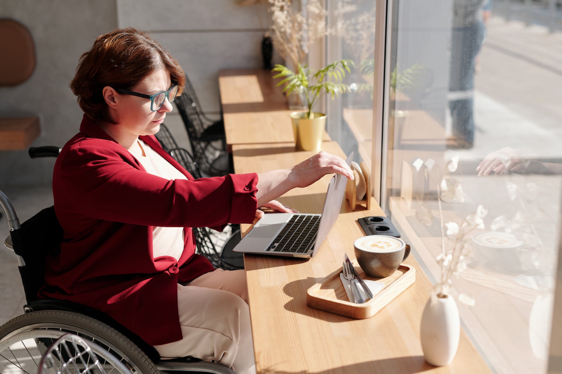 photo of woman using laptop